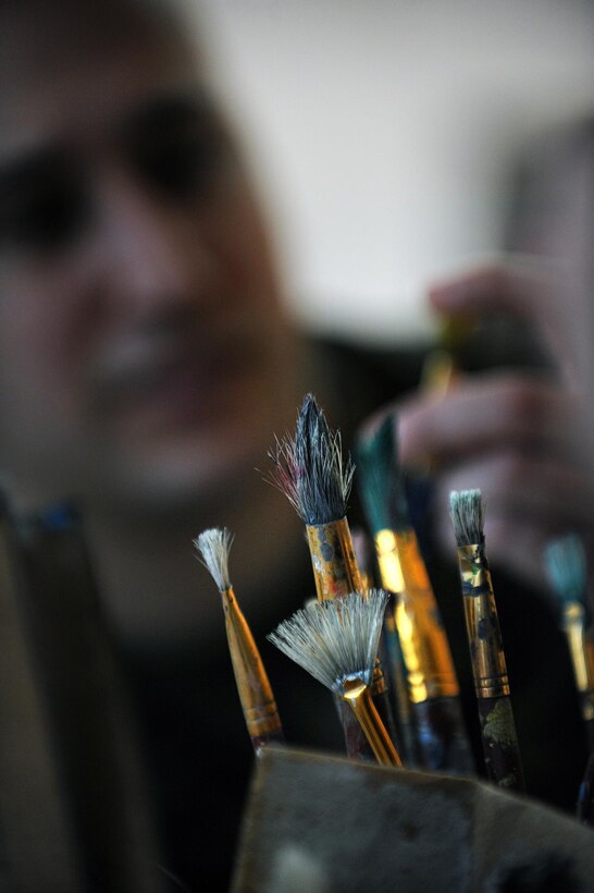 “Healing America’s Heroes through the Power of the Arts” Detail shot of art brushes as Marine Staff Sgt. Anthony Mannino performs Art Therapy as part of his Traumatic Brain Injury (TBI) treatment and recovery.  Staff Sgt. Mannino receives art and music therapy at the National Intrepid Center of Excellence, Walter Reed National Military Medical Center located in Bethesda, Maryland.  (Department of Defense photo by Marvin Lynchard)