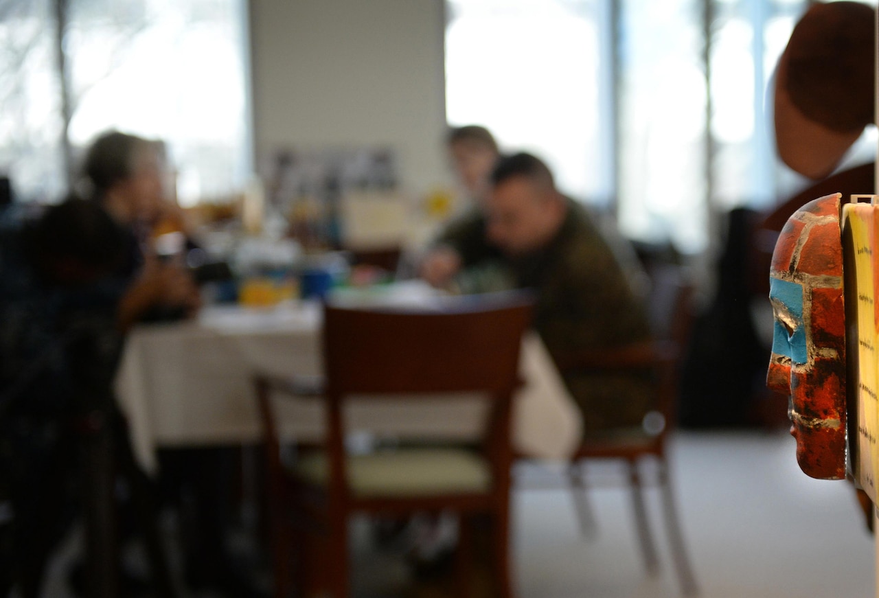 Marine Corps Staff Sgt. Anthony Mannino participates in an art therapy session with art therapy interns Adrienne Stamper, left, and Nancy Parfitt at the National Intrepid Center of Excellence in Bethesda, Md., March 1, 2016. DoD photo by Marvin Lynchard