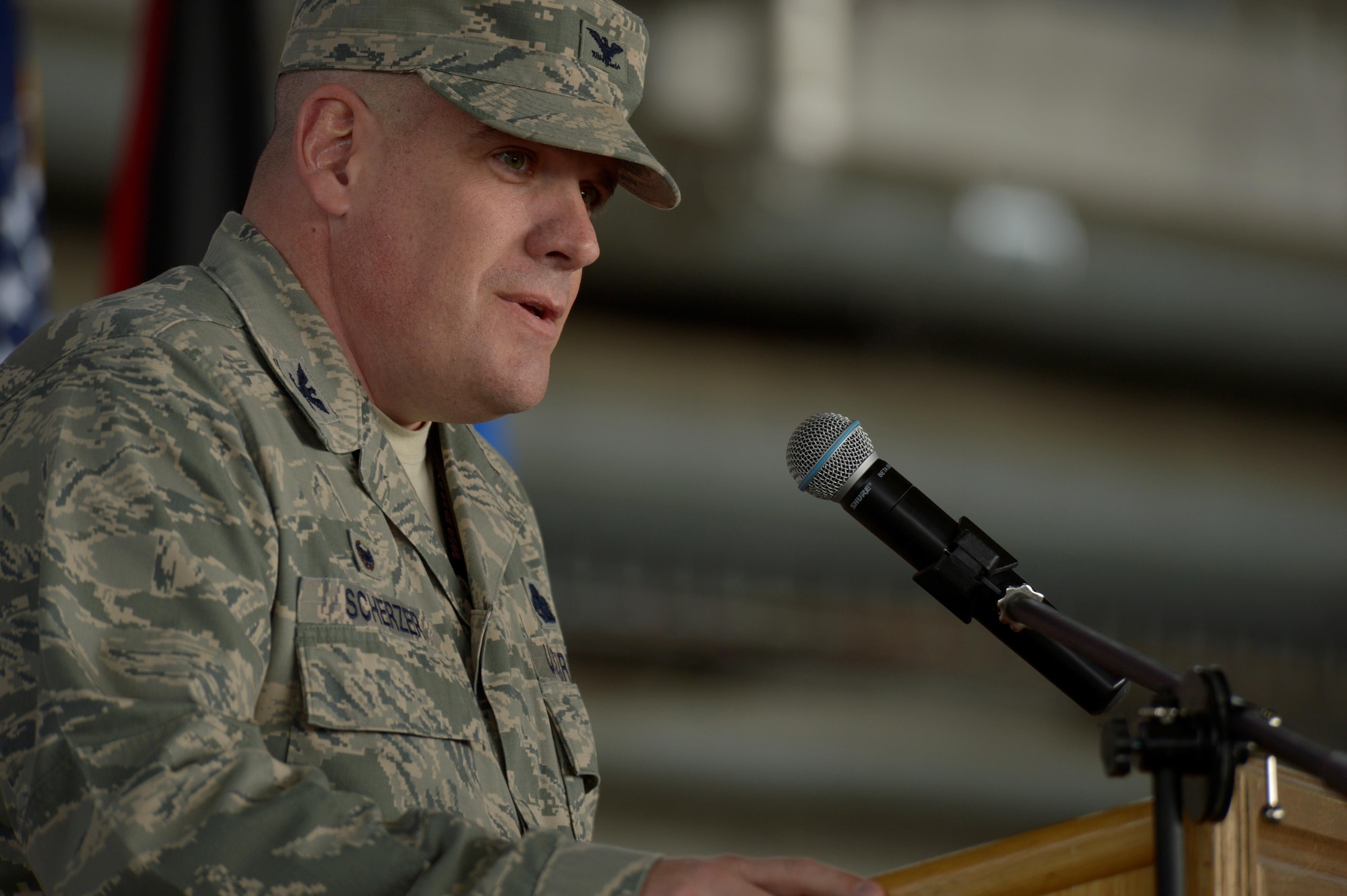 U.S. Air Force Col. Stephen Scherzer, 52nd Maintenance Group commander, speaks during a redesignation ceremony in Hangar One at Spangdahlem Air Base, Germany, July 14, 2016. The 52nd Component Maintenance Squadron and 52nd Equipment Maintenance Squadron have been retired and are now consolidated into the new 52nd Maintenance Squadron. (U.S. Air Force photo by Staff Sgt. Jonathan Snyder/Released)
