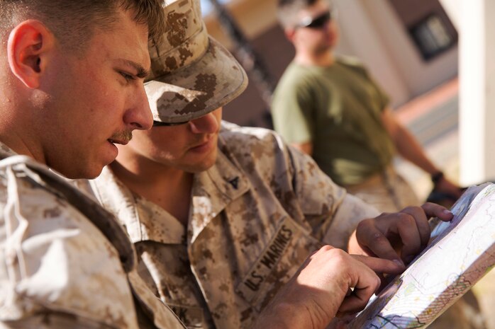 Marines with 5th Marine Regiment, 1st Marine Division consult a map while building a terrain model during the 1st Marine Division Infantry Squad Competition July 12, 2016 at Camp Pendleton, California. The 1st Marine Division hosted their annual Infantry Squad or “Super Squad” competition which pits the 1st, 5th and 7th Marine Regiments and a Light Armored Reconnaissance Battalion against each other in tests designed to evaluate their leadership and small unit infantry skills. (U.S. Marine Corps photo by Sgt. Abbey Perria)