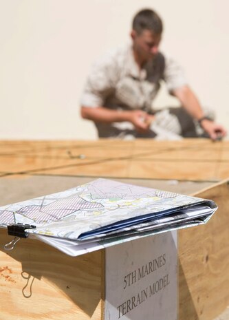 Marines with 5th Marine Regiment, 1st Marine Division build a terrain model during the 1st Marine Division Infantry Squad Competition July 12, 2016 at Camp Pendleton, California. The 1st Marine Division hosted their annual Infantry Squad or “Super Squad” competition which pits the 1st, 5th and 7th Marine Regiments and a Light Armored Reconnaissance Battalion against each other in tests designed to evaluate their leadership and small unit infantry skills. (U.S. Marine Corps photo by Sgt. Abbey Perria)