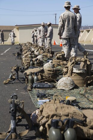 Marines with 5th Marine Regiment, 1st Marine Division lay out gear for an inspection during the 1st Marine Division Infantry Squad Competition July 13, 2016 at Camp Pendleton, California. The 1st Marine Division hosted their annual Infantry Squad or “Super Squad” competition which pits the 1st, 5th and 7th Marine Regiments and a Light Armored Reconnaissance Battalion against each other in tests designed to evaluate their leadership and small unit infantry skills. (U.S. Marine Corps photo by Sgt. Abbey Perria)