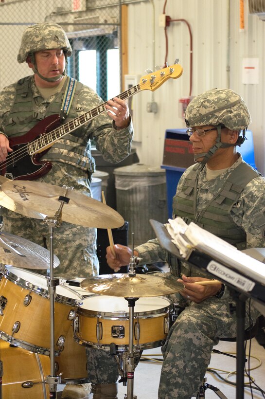 U.S. Army Sgt. 1st class Travis Tyson, Combo Nation 9.2, 208th Army Band, plays drums during Warrior Exercise (WAREX) 86-16-03 at Fort McCoy, Wis., July 15, 2016. WAREX is designed to keep soldiers all across the United States ready to deploy. (U.S. Army photo by SPC Thomas Watters/Released)