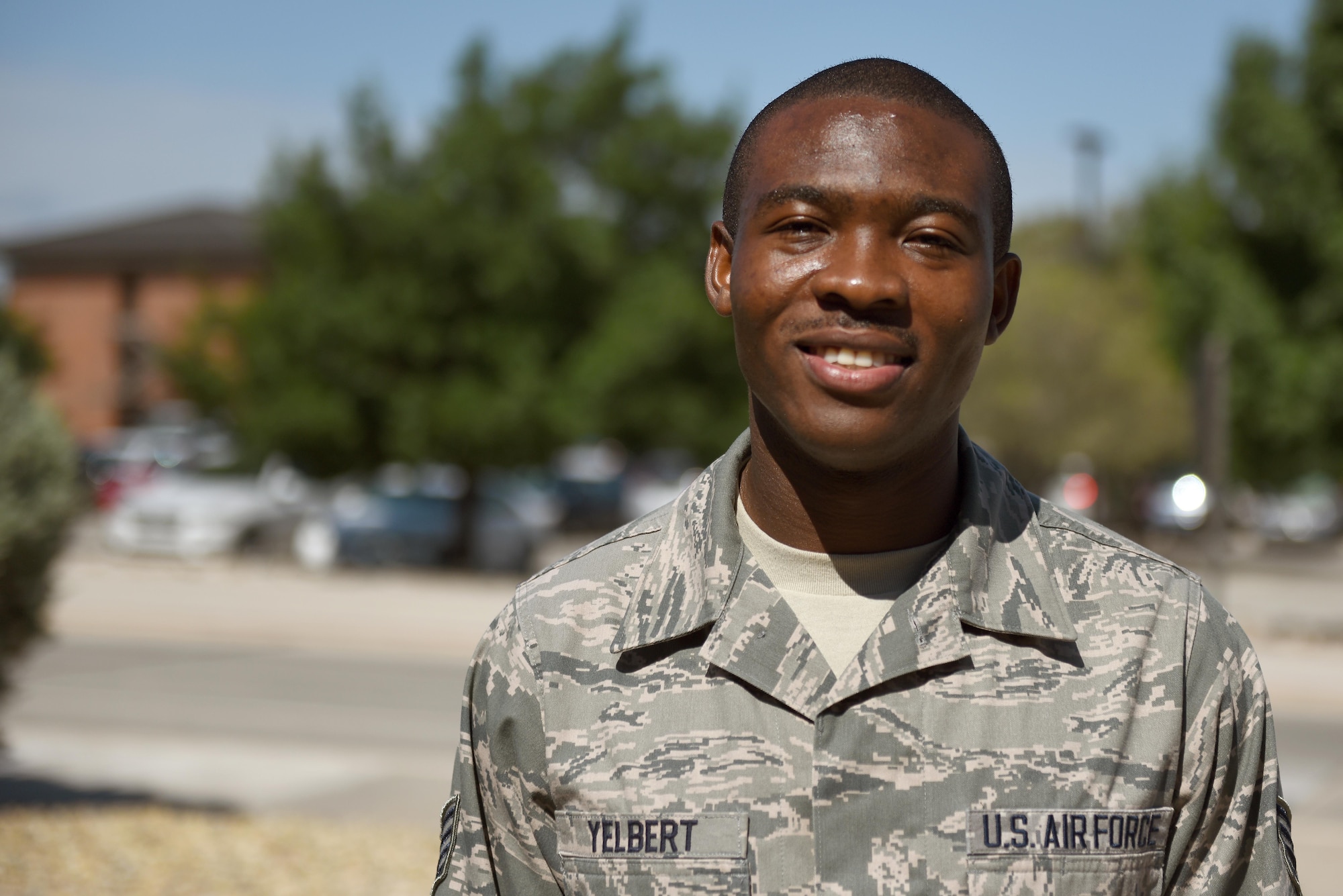 U.S. Air Force Staff Sgt. Stephen Yelbert, 17th Comptroller Squadron financial services technician and reports and analysis Non-Commissioned Officer in charge, stands outside of Norma Brown Building on Goodfellow Air Force Base, Texas, June 28, 2016. Yelbert received a scholarship for 4,000 dollars and congratulations on his hard work and efforts. (U.S. Air Force photo by Airman 1st Class Caelynn Ferguson/Released)