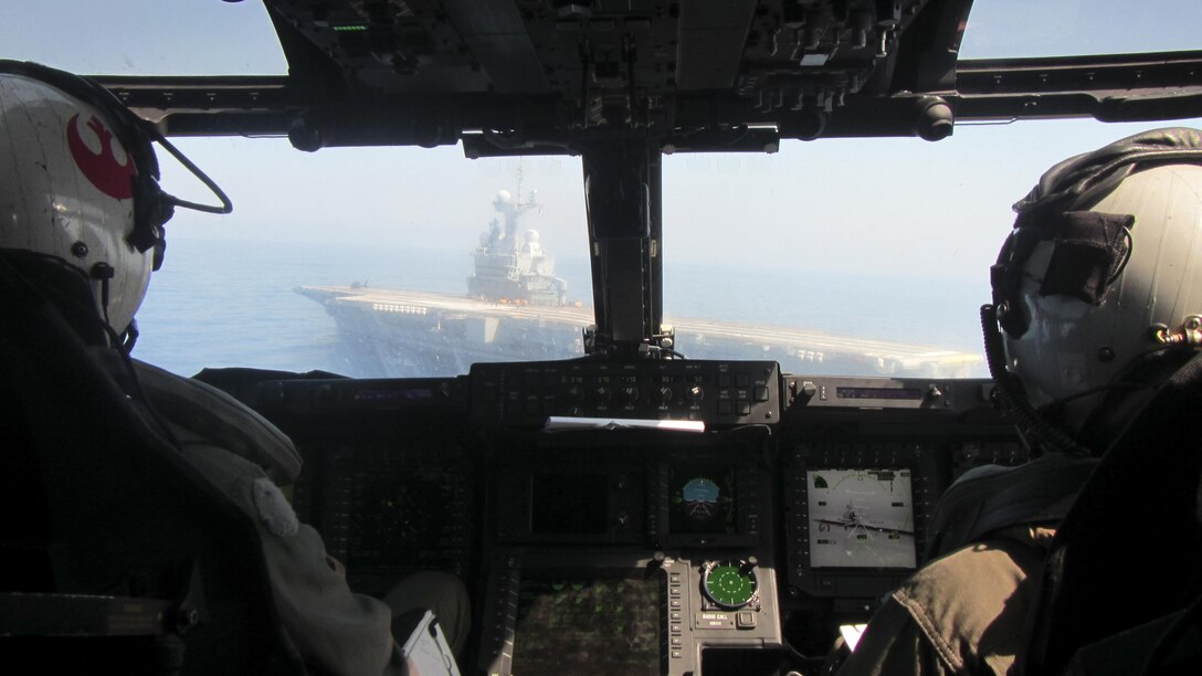 U.S. Marine Corps MV-22B Osprey pilots with Marine Medium Tiltrotor Squadron 263, Special Purpose Marine Air-Ground Task Force-Crisis Response-Africa prepare to land on the flight deck of the French aircraft carrier Charles de Gaulle, in the Mediterranean Sea, July 6, 2016. Training with the host nation partners allows the U.S. Marines to maintain proficiency in their core skills while also developing the interoperability skills essential for future operations.