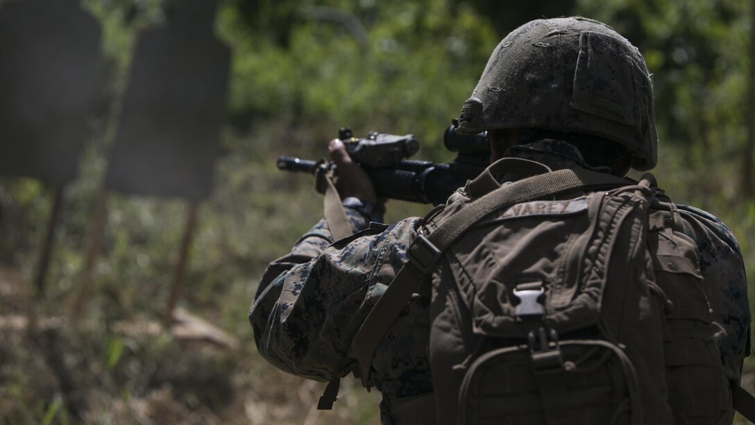 Cpl. Tony C. Alvarez fires an M4 Carbine during live fire training with Marines and Fijian Soldiers, July 12, 2016, at Ovalau, Fiji, as part of a multi-national, bilateral exercise between the nations. During the exercise the service members conducted jungle survival training, live fire ranges and patrol base operation training to increase interoperability and relations. Alvarez, from Luling, Louisiana, is an infantryman with Task Force Koa Moana, and is originally assigned to Headquarters and Service Company, 1st Battalion, 1st Marine Regiment, 1st Marine Division, I Marine Expeditionary Force. The Fijian Soldiers are with 3rd Battalion, 3rd Fiji Infantry Regiment, Republic of Fiji Military Forces.