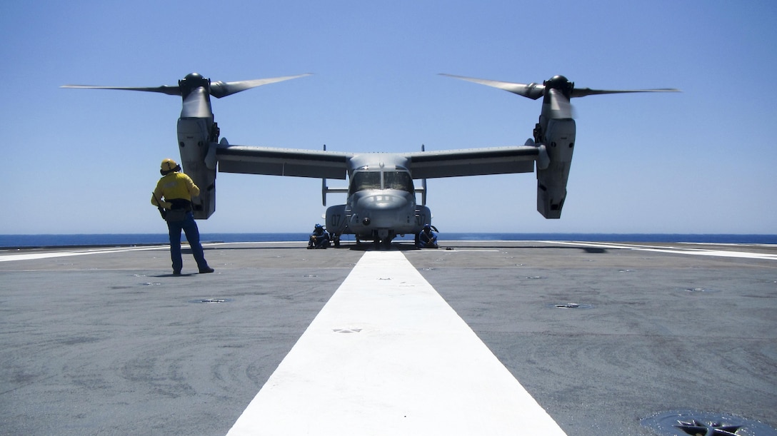 A French sailor supervises as other sailors secure an MV-22B Osprey to the flight deck of the French aircraft carrier Charles de Gaulle, in the Mediterranean Sea, July 6, 2016. Training with the host nation partners allows U.S. Marines with Special Purpose Marine Air-Ground Task Force-Crisis Response-Africa to maintain proficiency in their core skills while also developing the interoperability skills essential for future operations.