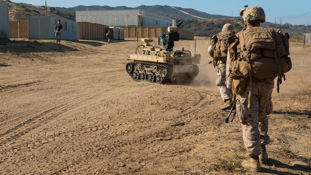 Marines with 3rd Battalion, 5th Marine Regiment conduct a patrol with a Weaponized Multi-Utility Tactical Transport vehicle at Marine Corps Base Camp Pendleton, California, July 13, 2016. The system is a multifunction force multiplier configured to persist, protect and project the small unit was built by the Marine Corps Warfighting Laboratory. The lab is conducting a Marine Air-Ground Task Force Integrated Experiment in conjunction with Rim of the Pacific exercise to explore new gear and assess its capabilities for potential future use. The Warfighting Lab identifies possible challenges of the future, develops new warfighting concepts, and tests new ideas to help develop equipment that meets the challenges of the future operating environment.