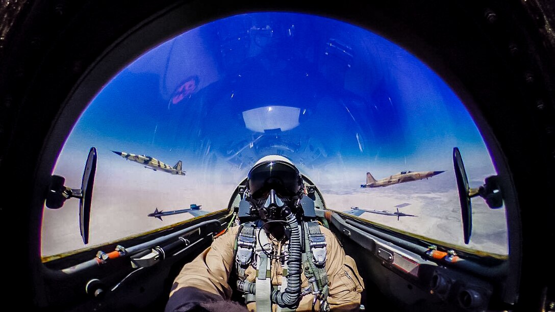U.S. Marine Lt. Col. William Sheridan pilots a F-5C above the grounds of Marine Corps Air Station Yuma, Arizona, on July 15, 2016. The "Snipers" of VMFT-401 are the United States Marine Corps' only adversary squadron. The squadron is manned by highly experienced Marine fighter pilots each averaging well more than 2,500 flight hours in tactical fighter aircraft. All "Sniper" pilots are air combat tactics instructors and most are graduates of "Top Gun" or the Marine Corps' Weapons and Tactics Instructor course.
