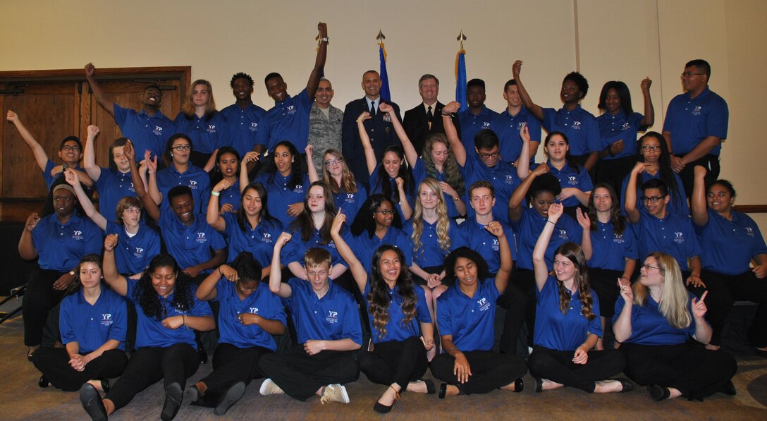 Leadership from the Air Force Installation and Mission Support Center -- Chief Master Sgt. Jose LugoSantiago, Maj. Gen. Bradley D. Spacy and Jon Grammer, director of programs -- join teens representing 43 Air Force base youth programs. The teens gathered in San Antonio for the annual Air Force Youth of the Year Camp. (U.S. Air Force photo/Carole Chiles Fuller/released)