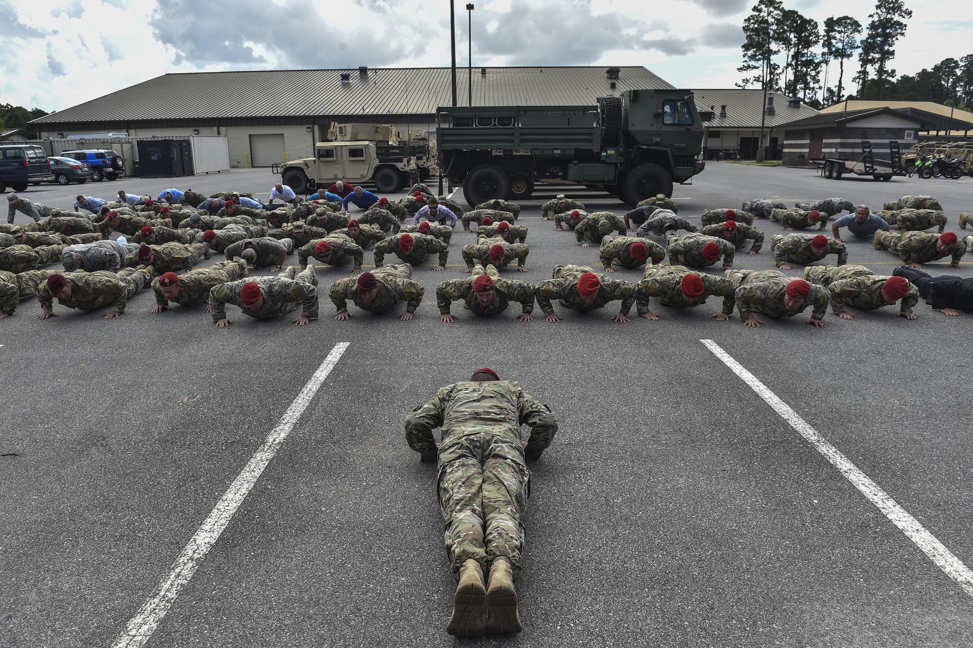 Chief Master Sgt. Sean Gleffe, combat control functional manager of Air Force Special Operations Command, leads Special Tactics Airmen in memorial pushups at Hurlburt Field, Fla., July 15, 2016. Gleffe retired after 30 years as a Special Tactics combat controller. Gleffe also served as the interim command chief of the 24th SOW. Throughout his Special Tactics career, Gleffe was certified a static line jump master, military freefall jump master and military dive supervisor. (U.S. Air Force photo by Senior Airman Ryan Conroy)