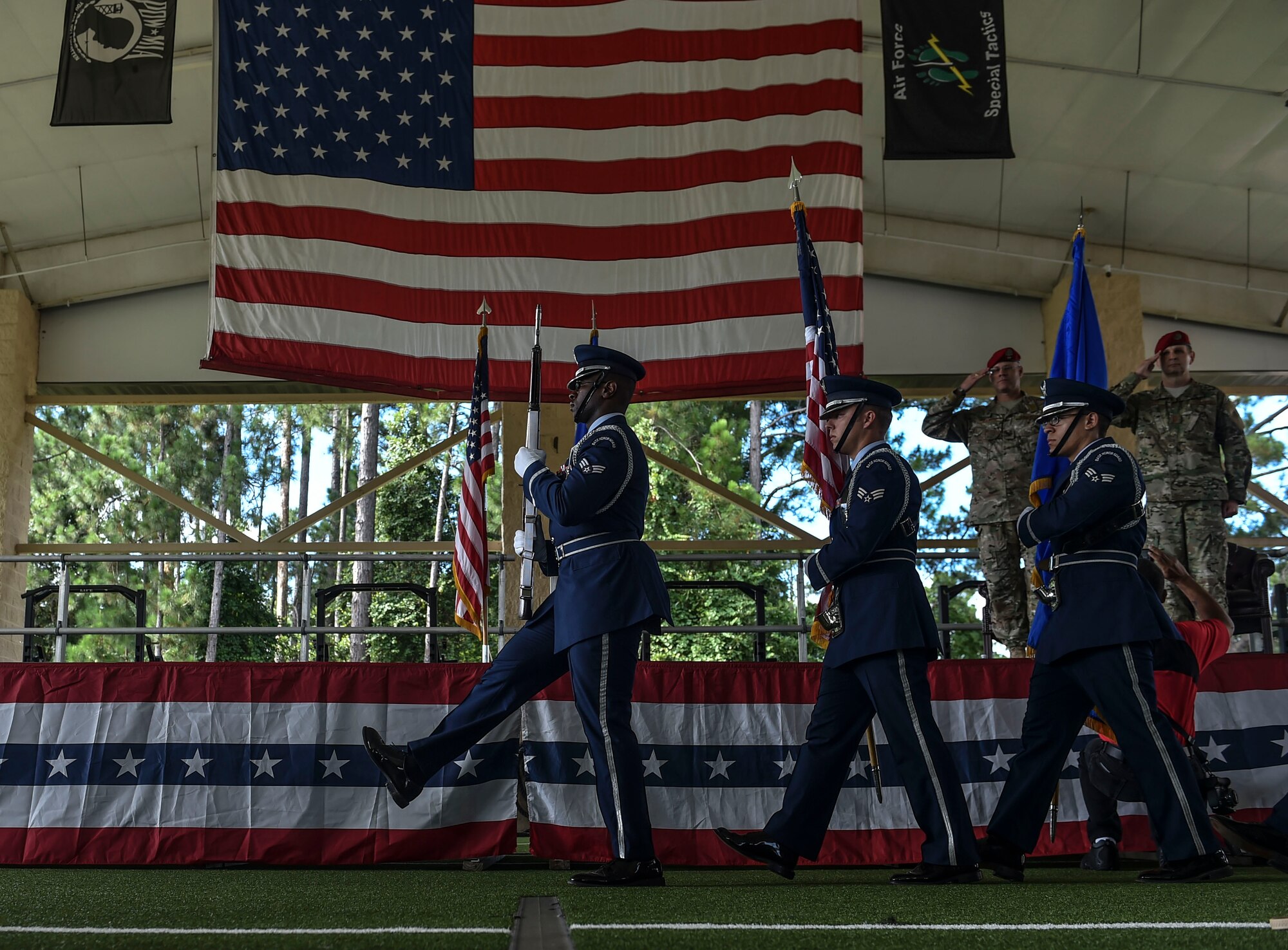 The Hurlburt Field Honor Guard posts the colors during a retirement ceremony at Hurlburt Field, Fla., July 15, 2016. Chief Master Sgt. Sean Gleffe, combat control functional manager of Air Force Special Operations Command, retired after 30 years as a Special Tactics combat controller. Gleffe also served as the interim command chief of the 24th SOW.  Throughout his Special Tactics career, Gleffe was certified a static line jump master, military freefall jump master and military dive supervisor. (U.S. Air Force photo by Senior Airman Ryan Conroy)