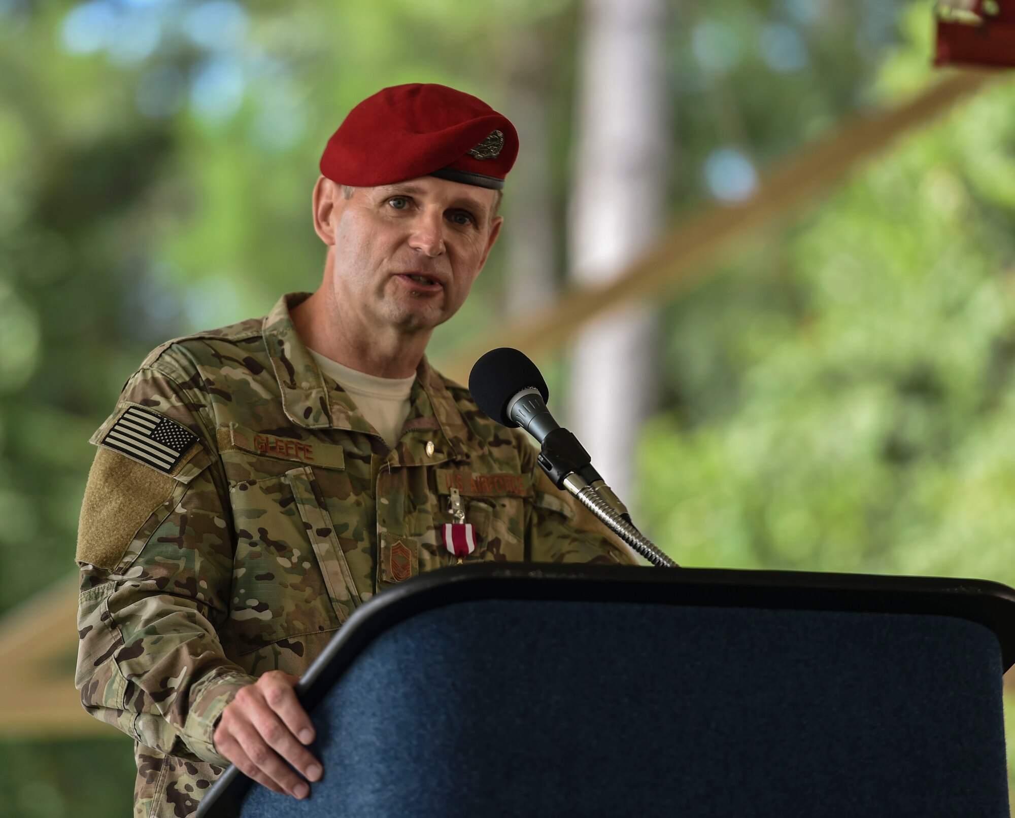 Chief Master Sgt. Sean Gleffe, combat control functional manager of Air Force Special Operations Command, speaks during his retirement ceremony at Hurlburt Field, Fla., July 15, 2016. Gleffe retired after 30 years as a Special Tactics combat controller. Throughout his Special Tactics career, Gleffe was certified a static line jump master, military freefall jump master and military dive supervisor. (U.S. Air Force photo by Senior Airman Ryan Conroy) 