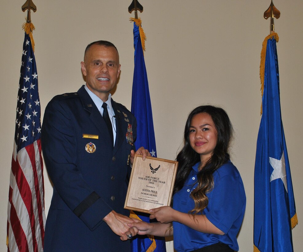 Maj. Gen. Bradley D. Spacy presents first-time camper Alyssa Price with her award. Price, who represents Incirlik Air Base, Turkey, had to evacuate to Germany with her family in March.  (U.S. Air Force photo/Carole Chiles Fuller/released)