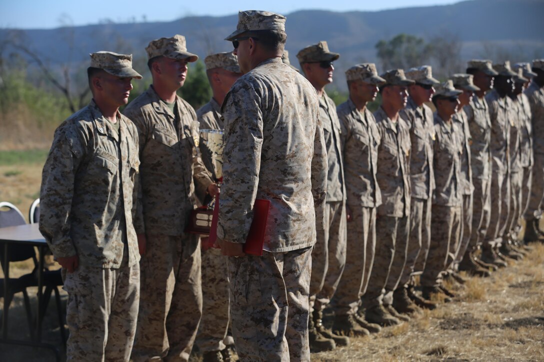 Marines with Company C, 1st Battalion, 7th Marine Regiment, members of the winning squad of the 2016 1st Marine Division Squad Competition, are awarded their annual infantry squad competition badges and Certificates of Commendation during an award ceremony at Camp Pendleton, Calif., July 14, 2016. The competition included combat marksmanship, physical fitness tests, offensive and defensive operations, and highlighted the Marine Corps’ focus on small-unit leadership. (U.S. Marine Corps photo by Lance Cpl. Shellie Hall)