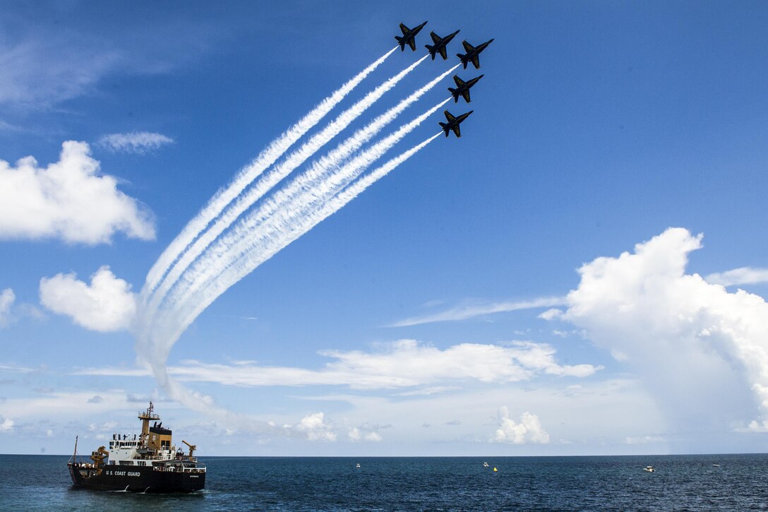 The Blue Angels, the Navy's flight demonstration squadron, soar in front of the crowd at the Pensacola Beach Air Show in Pensacola, Fla., July 14, 2016. The Blue Angels are scheduled to perform 58 demonstrations at 30 locations across the United States in 2016. Navy photo by Petty Officer 2nd Class Ian Cotter
