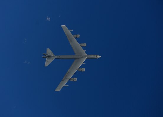 A B-52H Stratofortress from the 69th Bomb Squadron, Minot Air Force Base, N.D., flies over the Pacific Ocean during an international sinking exercise for Rim of the Pacific 2016 near Joint Base Pearl Harbor-Hickam, July 14, 2016. Twenty-six nations, more than 40 ships and submarines, more than 200 aircraft, and 25,000 personnel are participating in RIMPAC from June 30 to Aug. 4 in and around the Hawaiian Islands and Southern California. The world's largest international maritime exercise, RIMPAC, provides a unique training opportunity that helps participants foster and sustain the cooperative relationships that are critical to ensuring the safety of sea lanes and security on the world's oceans. RIMPAC 2016 is the 25th exercise in the series that began in 1971. (U.S. Air Force photo by Tech. Sgt. Aaron Oelrich/Released)