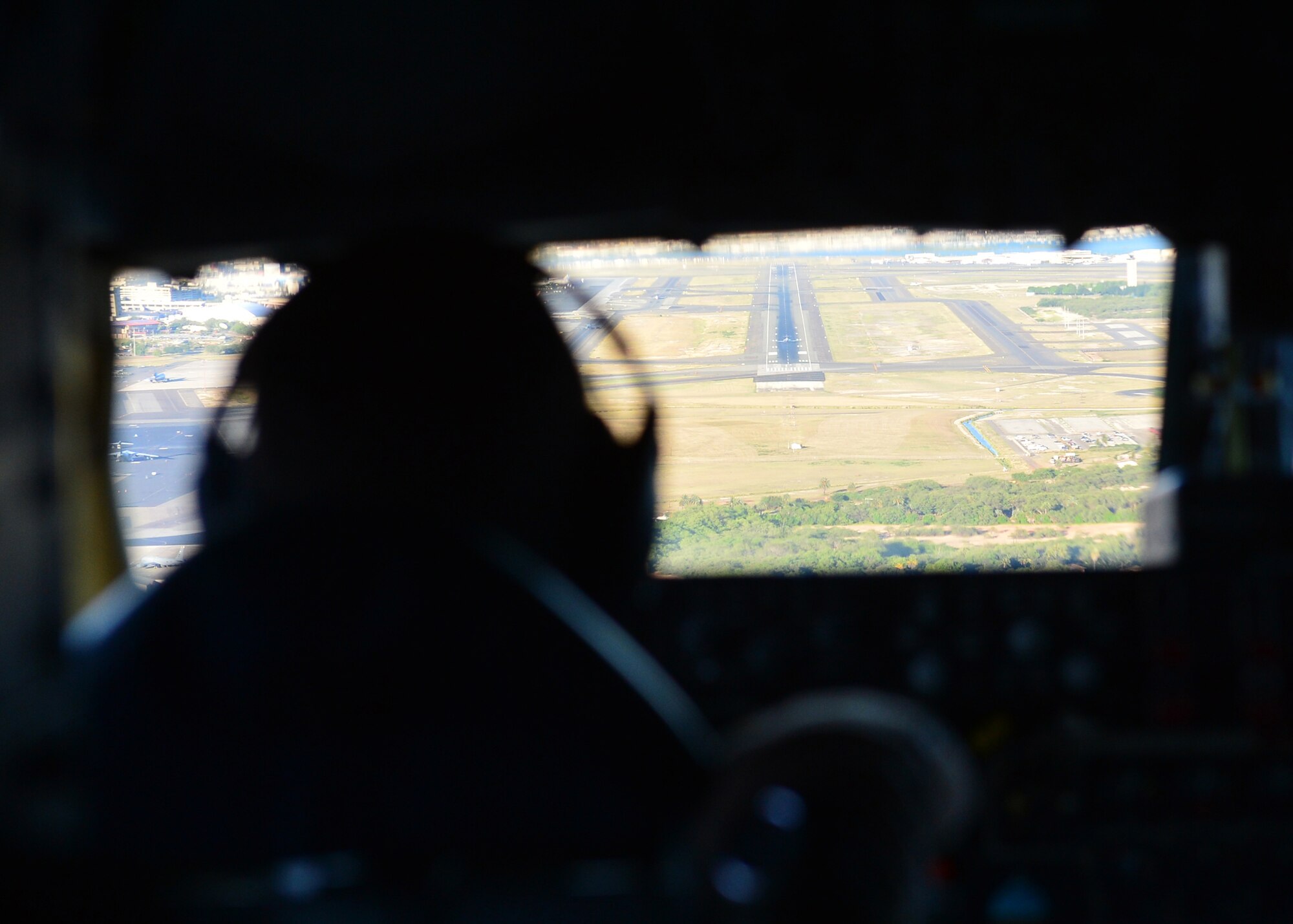 1st Lt. Brandon Aist, a 909th Air Refueling Squadron pilot, lines up to land a KC-135 Stratotanker during the Rim of the Pacific Exercise on Joint Base Pearl Harbor-Hickam, July 14, 2016. The exercise has a total of 49 ships, six submarines, 200 aircraft, and 25,000 personnel participating. RIMPAC is the world’s largest international maritime exercise, providing a unique training opportunity while fostering and sustaining cooperative relationships between participants critical to ensuring the safety of sea lanes and security on the world’s oceans. RIMPAC 2016 is the 25th exercise in the series that began in 1971. (U.S. Air Force photo by Tech. Sgt. Aaron Oelrich/Released)