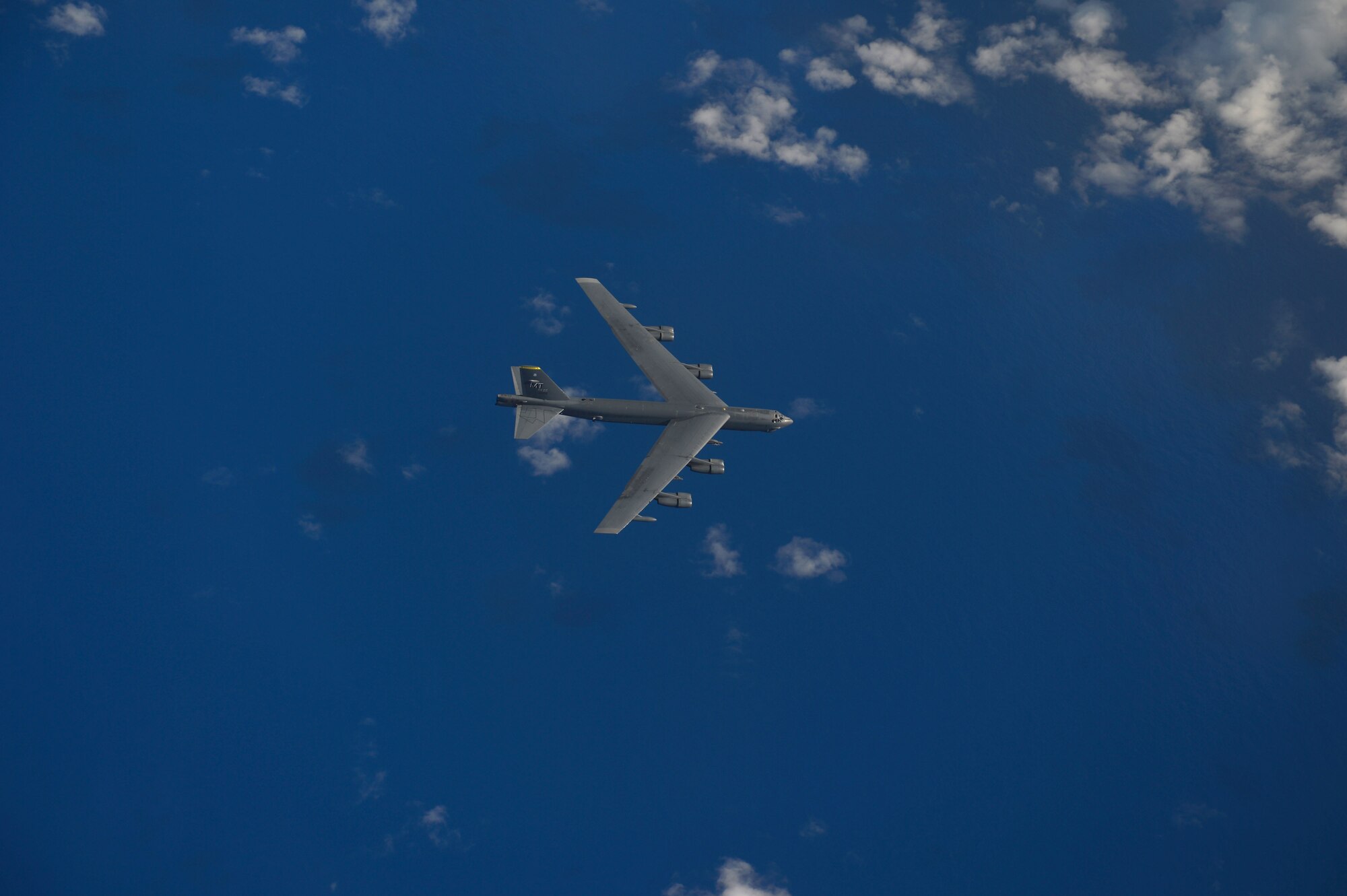 A B-52H Stratofortress from the 69th Bomb Squadron, Minot Air Force Base, N.D., flies over the Pacific Ocean during an international sinking exercise for Rim of the Pacific 2016 near Joint Base Pearl Harbor-Hickam, July 14, 2016. Twenty-six nations, more than 40 ships and submarines, more than 200 aircraft, and 25,000 personnel are participating in RIMPAC from June 30 to Aug. 4 in and around the Hawaiian Islands and Southern California. The world's largest international maritime exercise, RIMPAC, provides a unique training opportunity that helps participants foster and sustain the cooperative relationships that are critical to ensuring the safety of sea lanes and security on the world's oceans. RIMPAC 2016 is the 25th exercise in the series that began in 1971. (U.S. Air Force photo by Tech. Sgt. Aaron Oelrich/Released)

