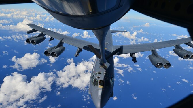 A B-52H Stratofortress assigned to the 69th Bomb Squadron, Minot Air Force Base, N.D., prepares to receive fuel from a KC-135 Stratotanker over the Pacific Ocean during an international sinking exercise for Rim of the Pacific 2016 near Joint Base Pearl Harbor-Hickam, July 14, 2016. Twenty-six nations, more than 40 ships and submarines, more than 200 aircraft, and 25,000 personnel are participating in RIMPAC from June 30 to Aug. 4 in and around the Hawaiian Islands and Southern California. The world's largest international maritime exercise, RIMPAC, provides a unique training opportunity that helps participants foster and sustain the cooperative relationships that are critical to ensuring the safety of sea lanes and security on the world's oceans. RIMPAC 2016 is the 25th exercise in the series that began in 1971. (U.S. Air Force photo by Tech. Sgt. Aaron Oelrich/Released)