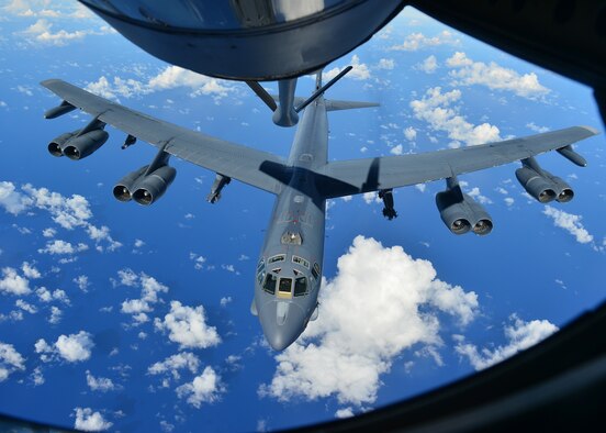 A B-52H Stratofortress from the 69th Bomb Squadron, Minot Air Force Base, N.D., prepares to receive fuel from a KC-135 Stratotanker over the Pacific Ocean during an international sinking exercise for Rim of the Pacific 2016 near Joint Base Pearl Harbor-Hickam, July 14, 2016. Twenty-six nations, more than 40 ships and submarines, more than 200 aircraft, and 25,000 personnel are participating in RIMPAC from June 30 to Aug. 4 in and around the Hawaiian Islands and Southern California. The world's largest international maritime exercise, RIMPAC, provides a unique training opportunity that helps participants foster and sustain the cooperative relationships that are critical to ensuring the safety of sea lanes and security on the world's oceans. RIMPAC 2016 is the 25th exercise in the series that began in 1971. (U.S. Air Force photo by Tech. Sgt. Aaron Oelrich/Released)

