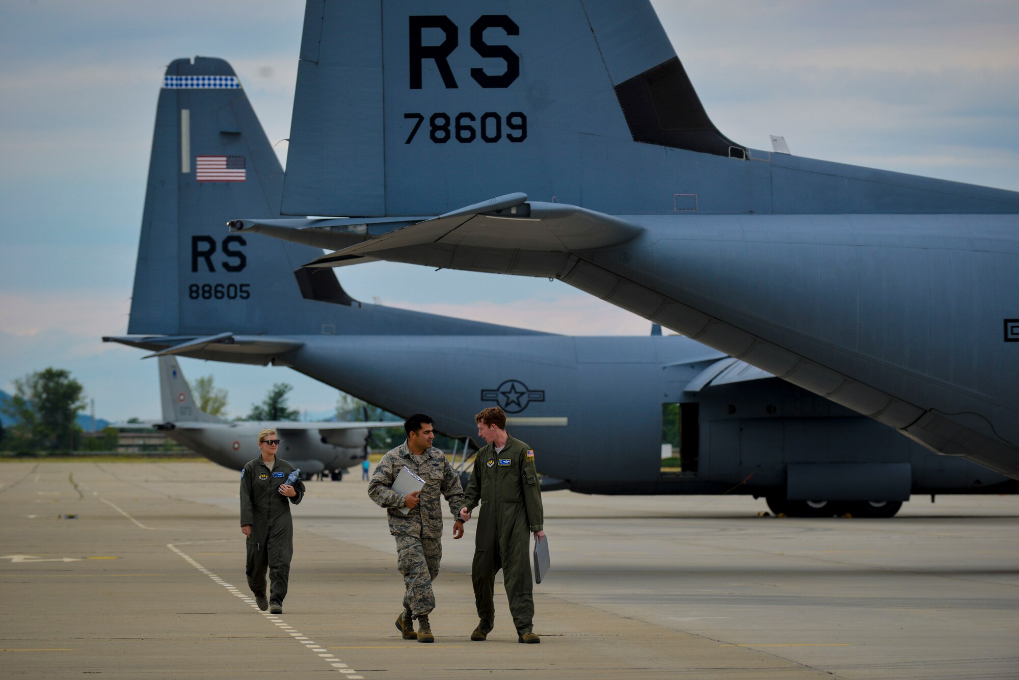 Senior Airman Emily Mitchell and Staff Sgt. Joshua Nelson, both 37th Airlift Squadron loadmasters sit on the ramp of a C-130J Super Hercules during a formation flight during Exercise Thracian Summer 2016 July 17, Plovdiv, Bulgaria. Through Exercise Thracian Summer, the U.S. and Bulgaria will enhance their mutual ability to work together, with other NATO nations, and with key partners on regional security (U.S. Air Force photo/Senior Airman Nicole Keim)