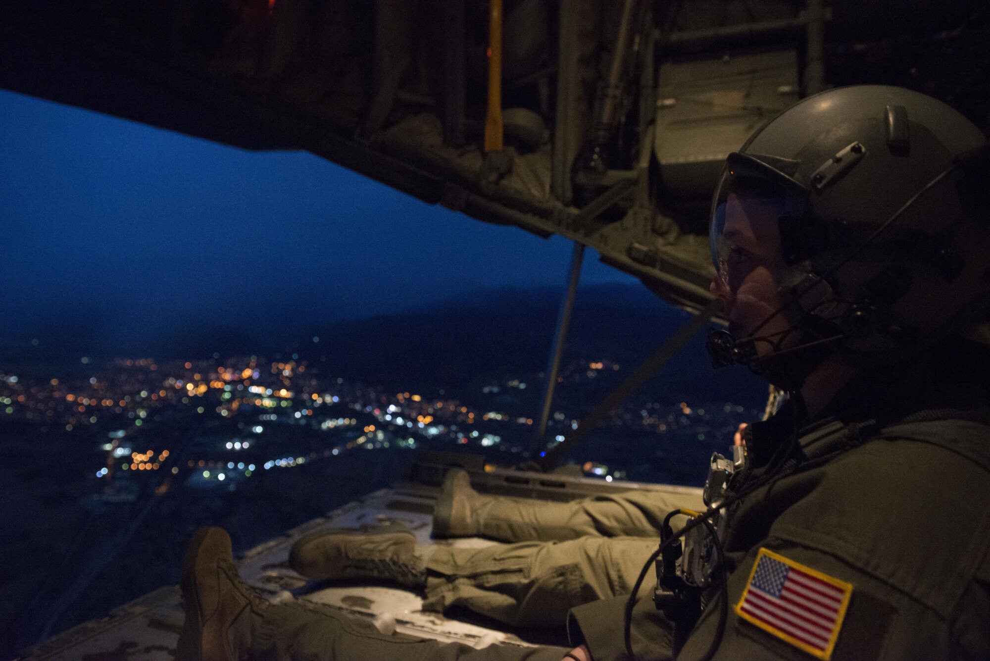 Senior Airman Emily Mitchell and Staff Sgt. Joshua Nelson, both 37th Airlift Squadron loadmasters sit on the ramp of a C-130J Super Hercules during a formation flight during Exercise Thracian Summer 2016 July 17, Plovdiv, Bulgaria. Through Exercise Thracian Summer, the U.S. and Bulgaria will enhance their mutual ability to work together, with other NATO nations, and with key partners on regional security (U.S. Air Force photo/Senior Airman Nicole Keim)