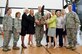 Col. Michael W. Grismer Jr., 436th Airlift Wing commander, and Judy Diogo, Central Delaware Chamber of Commerce president, hold the 2015 Abilene Trophy during the presentation ceremony July 13, 2016, at the Air Mobility Command Museum on Dover Air Force Base, Del. The Abilene Trophy, previously known as the Air Mobility Community Support Award which was established in 1998, is awarded annually to a civilian community for outstanding support to a nearby Air Mobility Command base. Pictured on stage with Grismer and Diogo were representatives of the 436th and 512th Airlift Wings, Air Force Mortuary Affairs Operations, Abilene Chamber of Commerce and the CDCC. (U.S. Air Force photo/Roland Balik) 