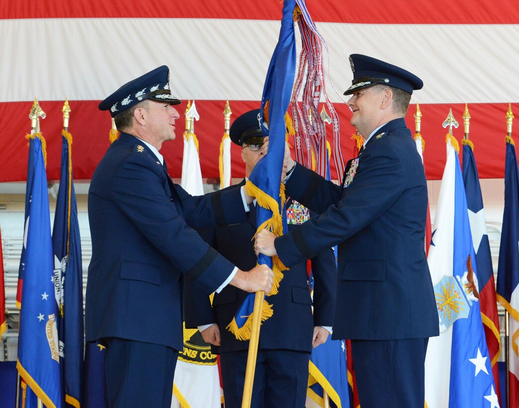 Gen. David L. Goldfein, Chief of Staff of the U.S. Air Force, presents the Air Force Special Operations Command flag to Lt. Gen. Brad Webb during the change of command ceremony at Hurlburt Field Fla., July 19, 2016.  Webb is the 11th commander of AFSOC, and he returns to the Florida panhandle for his fifth tour of duty.  (U.S. Air Force photo by Staff Sgt. Melanie Holochwost)
