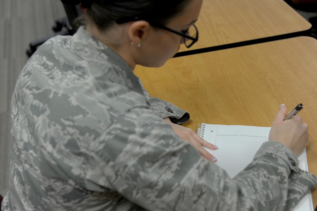 U.S. Air Force Airman Taylor Ross, 17th Security Forces Squadron installation entry controller, takes notes during the Airmen professional development course at the Consolidated Learning Center on Goodfellow Air Force Base, Texas, July 15, 2016. Ross attended the two-day course and learned about retirement, supervisor responsibilities and feedback. (U.S. Air Force photo by Senior Airman Joshua Edwards/Released)
