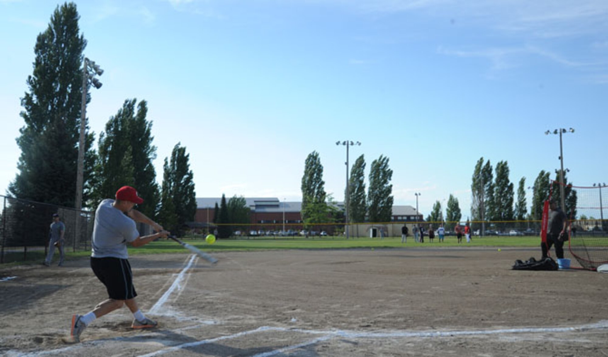 Airman 1st Class Jin Chang, 92nd Force Support Squadron storeroom technician, swings for the fences during the home run derby at Fairchild Air Force Base, Wash., July 18, 2016. The home run derby and all-star softball game were the first held at the base.