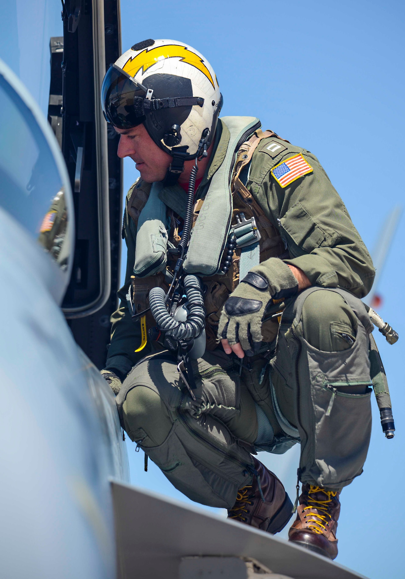 Navy EA-18G Growler Pilot Lt. Eric Holler, assigned to Electronic Attack Squadron (VAQ) 129, checks the cockpit of a Growler while training at Ellsworth Air Force Base, S.D., July 15, 2016. During the training, Naval aviators from the VAQ-129 were able to use the Powder River Training Complex near Ellsworth to complete necessary airborne electronic attack tactics. (U.S. Air Force photo by Airman 1st Class Sadie Colbert/Released)