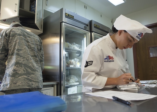 Airman 1st Class Alexandra Ayub, 90th Force Support Squadron missile chef, F.E. Warren Air Force Base, Wyo., takes account of the inventory in her kitchen in the 90th Missile Wing Missile Complex May 14, 2016. Ayub recently won the Arthur J. Myers Food Service Excellence Award, an Air Force-level award for contributing significantly to the food services career field. (U.S. Air Force photo by Lan Kim)