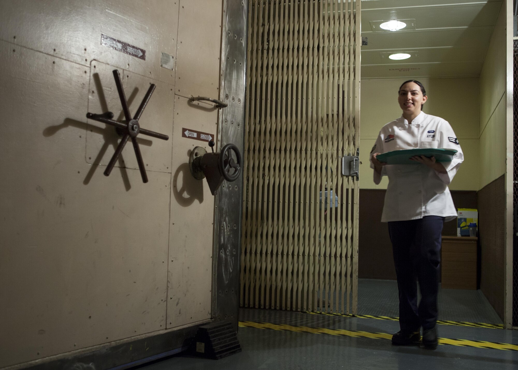Airman 1st Class Alexandra Ayub, 90th Force Support Squadron missile chef, F.E. Warren Air Force Base, Wyo., exits the elevator leading to the underground launch control center at a missile alert facility in the 90th Missile Wing Missile Complex May 17, 2016. Missile chefs are the chiefs of morale at each MAF, and a large part of their efforts to that end are fueled by providing Airmen on site nutritious, tasty meals. (U.S. Air Force photo by Lan Kim)