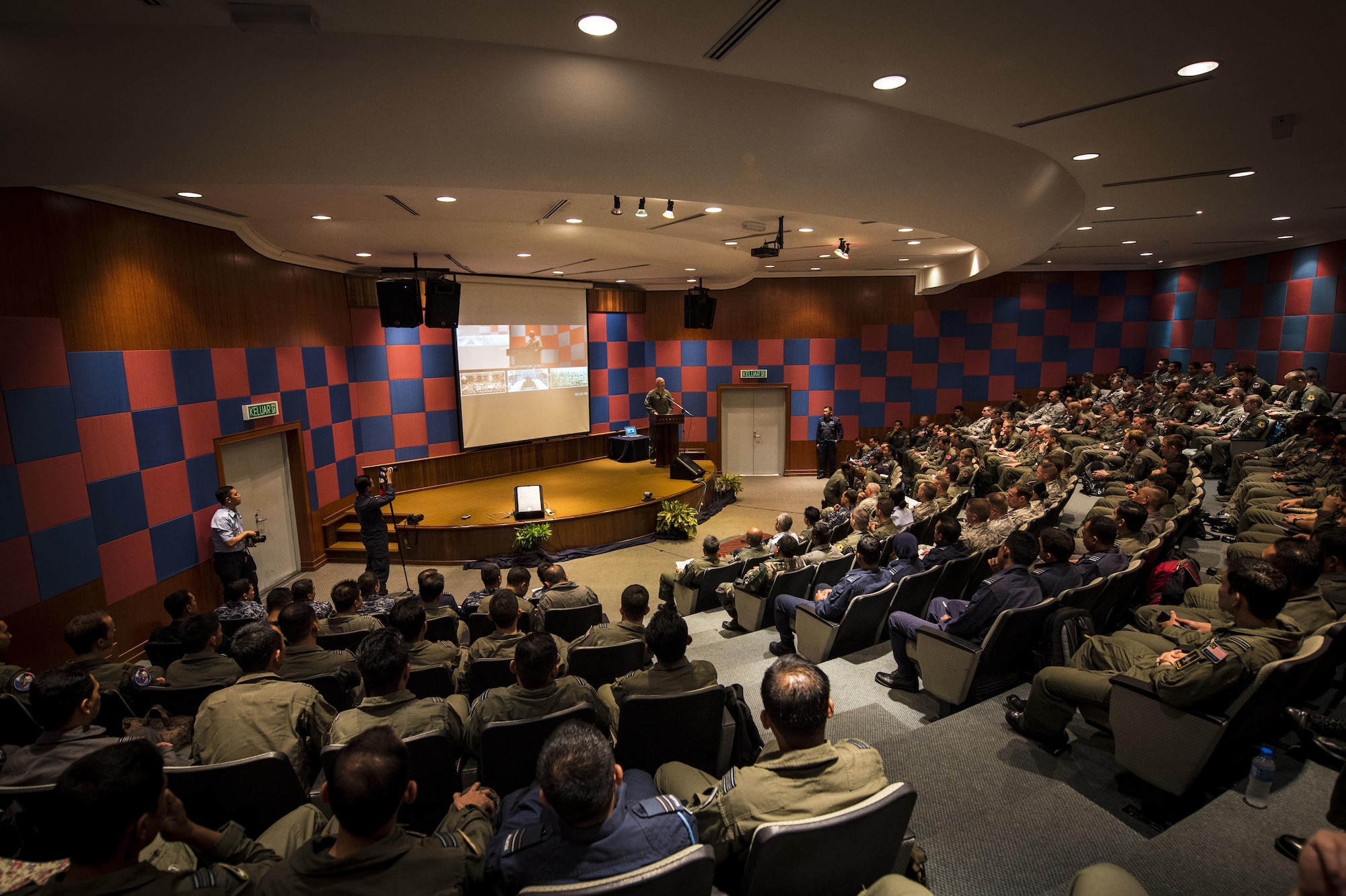 Col Travis D. Rex, U.S. Air Force Exercise Director, speaks at the opening ceremony for exercise Cope Taufan 2016, at Pangkalan Udara Butterworth Air Base, Malaysia, 18 July 2016. Cope Taufan 16 is a PACAF-led exercise that reinforces U.S. Pacific Command Theater Security Cooperation goals for the Southeast Asian region and demonstrates U.S. capability to project forces strategically in a combined, joint environment.  More than 450 Airmen are participating, as well as four U.S. Air Force airframes.  (U.S. Air Force photo by Tech. Sgt. Araceli Alarcon)