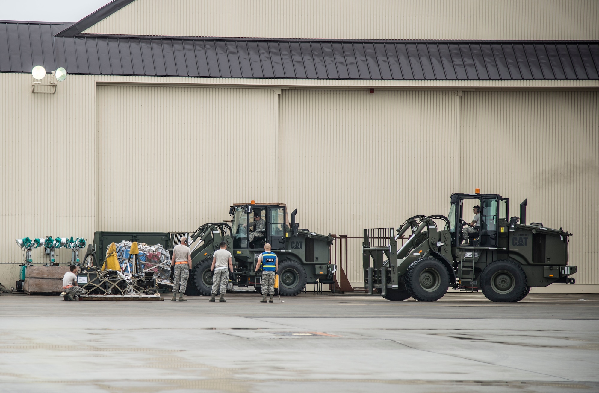 U.S. Air Force Airmen from the 35th Logistics Readiness Squadron load pallets onto a k-loader at Misawa Air Base, Japan, July 17, 2016. The Airmen loaded more than 461,000 pounds of cargo for Exercise Pitch Black, a three-week multi-national exercise including participants from Australia, Canada, France (New Caledonia), Germany, Indonesia, the Netherlands, New Zealand, Singapore, Thailand, Turkey and the United States. (U.S. Air Force photo by Senior Airman Brittany A. Chase)