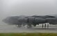 Airmen assigned to the 36th Expeditionary Aircraft Maintenance Squadron take shelter under a B-52H Stratofortress prior to the start of a munitions loading exercise July 13, 2016, at Andersen Air Force Base, Guam. During the exercise, Airmen practiced loading inert munitions including, AGM-86 Conventional Air-Launched Cruise Missiles and AGM-158 Joint Air-to-Surface Standoff Missiles. (U.S. Air Force photo by Airman 1st Class Alexa Ann Henderson/Released)