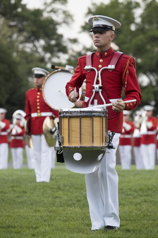 A Marine from the United States Marine Drum and Bugle Corps performs during the Sunset Parade at Arlington, Va., July 19, 2016. The guest of honor for the parade was retired Lt. Col. Jack Matthews and the hosting official was Maj. Gen. John R. Ewers Jr., staff judge advocate to the Commandant of the Marine Corps. (Official Marine Corps photo by Cpl. Chi Nguyen/Released)