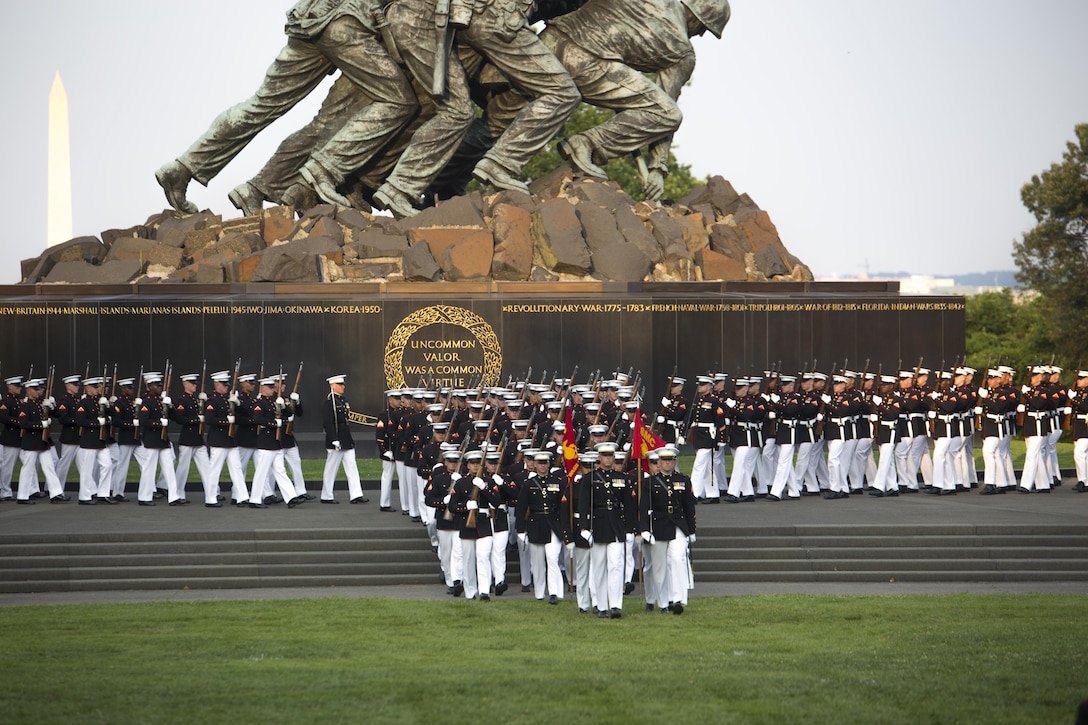 Marines from Marine Barracks Washington, D.C., perform during the Sunset Parade at Arlington, Va., July 19, 2016. The guest of honor for the parade was retired Lt. Col. Jack Matthews and the hosting official was Maj. Gen. John R. Ewers Jr., staff judge advocate to the Commandant of the Marine Corps. (Official Marine Corps photo by Lance Cpl. Robert Knapp/Released)