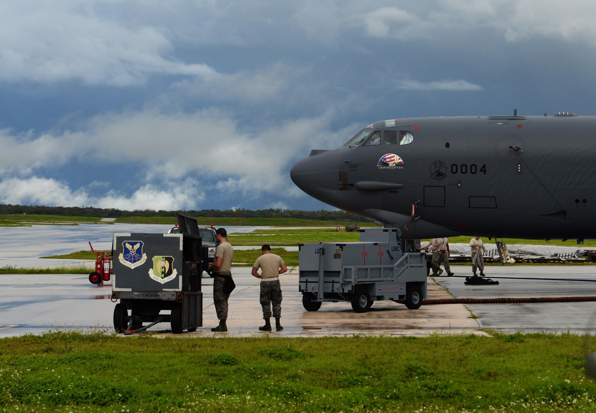 Members of the 36th Expeditionary Aircraft Maintenance Squadron participate in a munitions loading exercise July 13, 2016, at Andersen Air Force Base, Guam. The exercise tested their ability to quickly and safely load a B-52H Stratofortress with munitions, which is integral to provide combat-ready aircraft in support of U.S. Pacific Command’s continuous bomber presence mission. (U.S. Air Force photo by Airman 1st Class Alexa Ann Henderson/Released)
