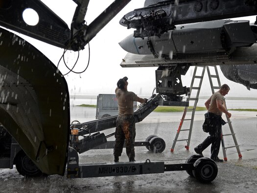 Airman 1st Class Michael O’Donnell, left, Senior Airman James Rutt, 36th Expeditionary Aircraft Maintenance Squadron weapons load crew team members, load an inert AGM-158 Joint Air-to-Surface Standoff Missile onto a B-52H Stratofortress during a munitions loading exercise July 13, 2016, at Andersen Air Force Base, Guam. The exercise tested their ability to quickly and safely load a B-52H with munitions, which is integral to provide combat-ready aircraft in support of U.S. Pacific Command’s continuous bomber presence mission. (U.S. Air Force photo by Airman 1st Class Alexa Ann Henderson/Released)