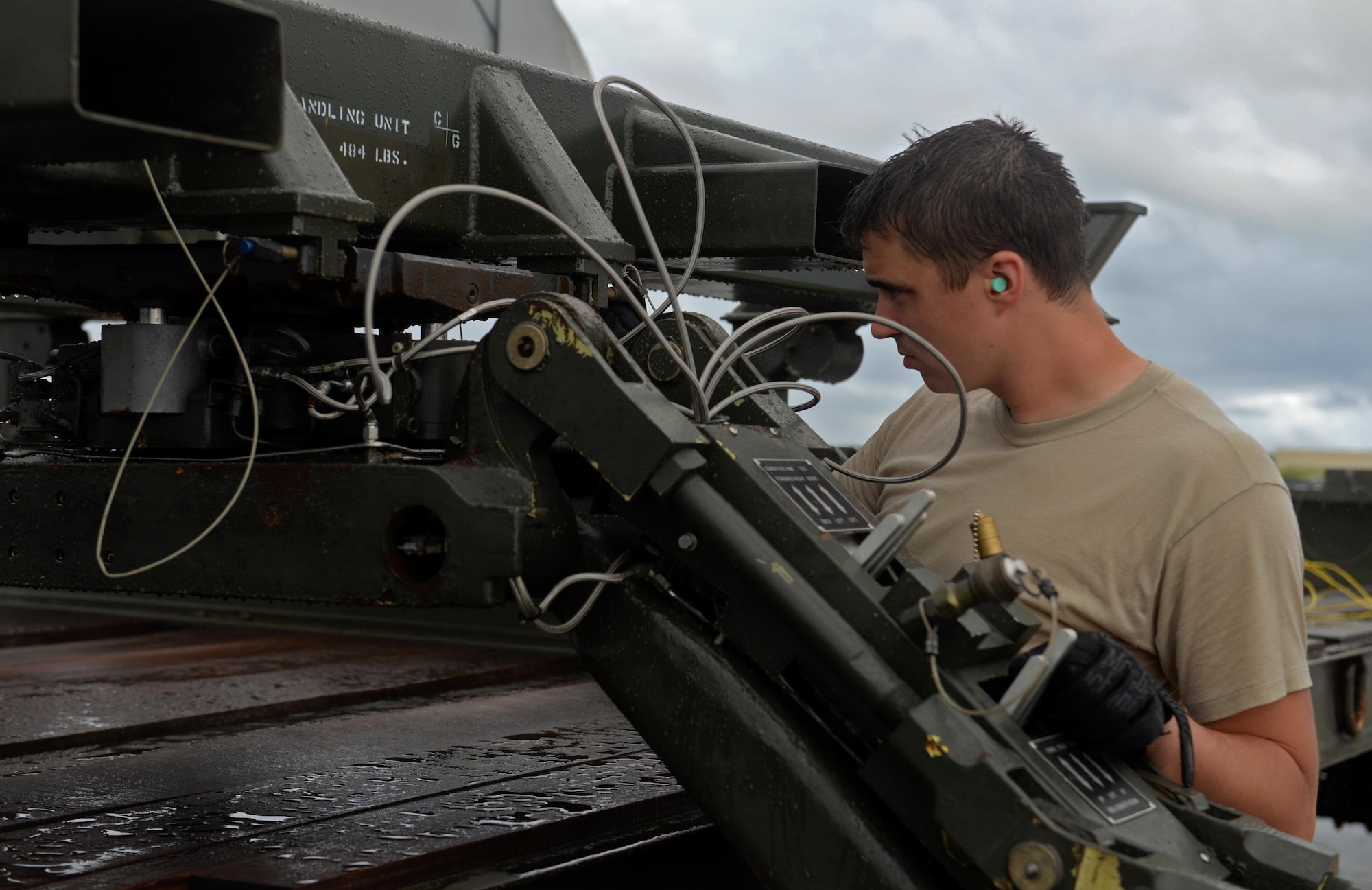 Airman 1st Class Michael O’Donnell, 36th  Expeditionary Aircraft Maintenance Squadron weapons load crew team member, operates a MHU-83 bomb lift truck during a munitions loading exercise July 13, 2016, at Andersen Air Force Base, Guam.  Airmen practiced loading an entire B-52 Stratofortress with 12 AGM-158 Joint Air-to-Surface Standoff Missiles and eight AGM-158 Joint Air-to-Surface Standoff Missiles. (U.S. Air Force photo by Airman 1st Class Alexa Ann Henderson/Released)