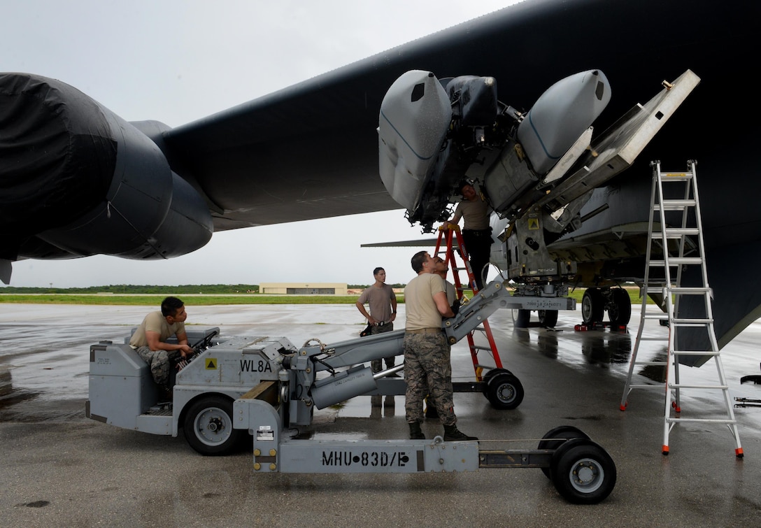 Airmen assigned to the 36th Expeditionary Aircraft Maintenance Squadron load an inert AGM-158 Joint Air-to-Surface Standoff Missile onto a B-52H Stratofortress during a munitions loading exercise July 13, 2016, at Andersen Air Force Base, Guam. The U.S. Pacific Command has maintained a rotational strategic bomber presence in the region for more than a decade. These aircraft and the men and women who fly and support them provide a significant capability that enables U.S. readiness and commitment to deterrence, provides assurances to allies, and strengthens regional security and stability in the Indo-Asia-Pacific region. 
(U.S. Air Force photo by Airman 1st Class Alexa Ann Henderson/Released)
