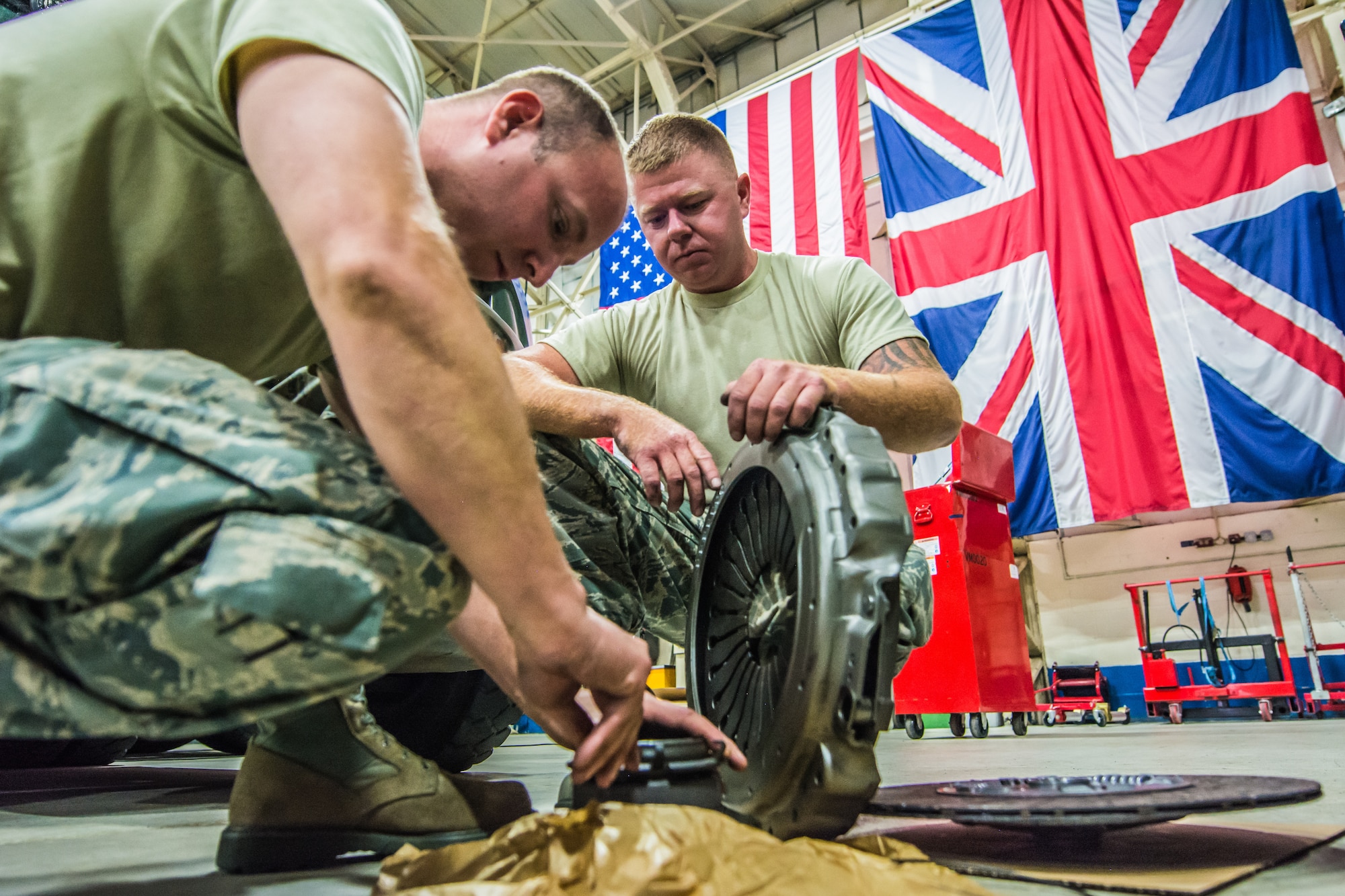 U.S. Air Force Tech Sgt. Brandon M. Guardado (left) and Staff Sgt. Cory C. Clary, with the 139th Logistics Readiness (139 LRS) Squadron replaces a clutch to a MAN 6x4 10-ton tractor at Royal Air Force Mildenhall, England, July 6, 2016.  The 139 LRS were conducting deployment field training in their respective career fields as part of annual training requirements.  (U.S Air National Guard photo by Senior Airman Patrick P. Evenson/Released)