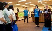 18th Force Support Squadron librarians gives a tour of the library to local Okinawan librarians July 13, 2016, at Kadena Air Base, Japan. Some Okinawan libraries are setting up an “American corner” in their libraries, where their American customers can come in and learn in a culturally familiar environment. (U.S. Air Force photo by Airman 1st Class Corey M. Pettis)