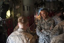 Chief Master Sgt. Terrence Greene, U.S. Forces Japan and 5th Air Force command chief master sergeant, speaks with Airmen assigned to the 18th Wing June 28, 2016, at Kadena Air Base, Japan. Greene visited Kadena to discuss the importance of the Status of Forces Agreement and the Treaty of Mutual Cooperation and Security between the governments of the United States of America and Japan, while also laying out what they clearly state and how it affects members of the U.S. Forces in Japan. (U.S. Air Force photo by Airman 1st Class Corey M. Pettis)