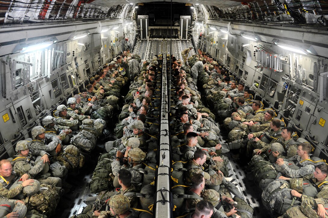 Paratroopers sit inside a C17 Globemaster III aircraft before participating in airborne operations over Sicily drop zone during Battalion Mass Tactical Week at Pope Army Airfield, N.C., July 12, 2016. Air Force photo by Staff Sgt. Sandra Welch