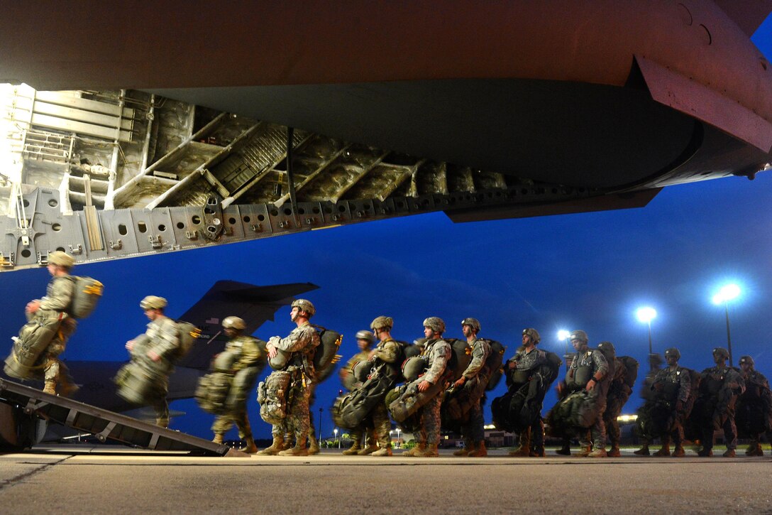 Paratroopers load onto a C-17 Globemaster III aircraft during Battalion Mass Tactical Week at Pope Army Airfield, N.C., July 12, 2016. Air Force photo by Staff Sgt. Sandra Welch
