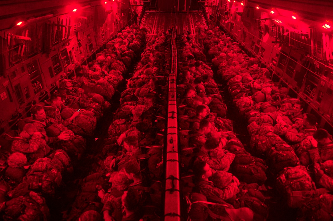 Paratroopers sit inside a C17 Globemaster III aircraft before participating in airborne operations over Sicily drop zone during Battalion Mass Tactical Week at Pope Army Airfield, N.C., July 12, 2016. Air Force photo by Staff Sgt. Sandra Welch