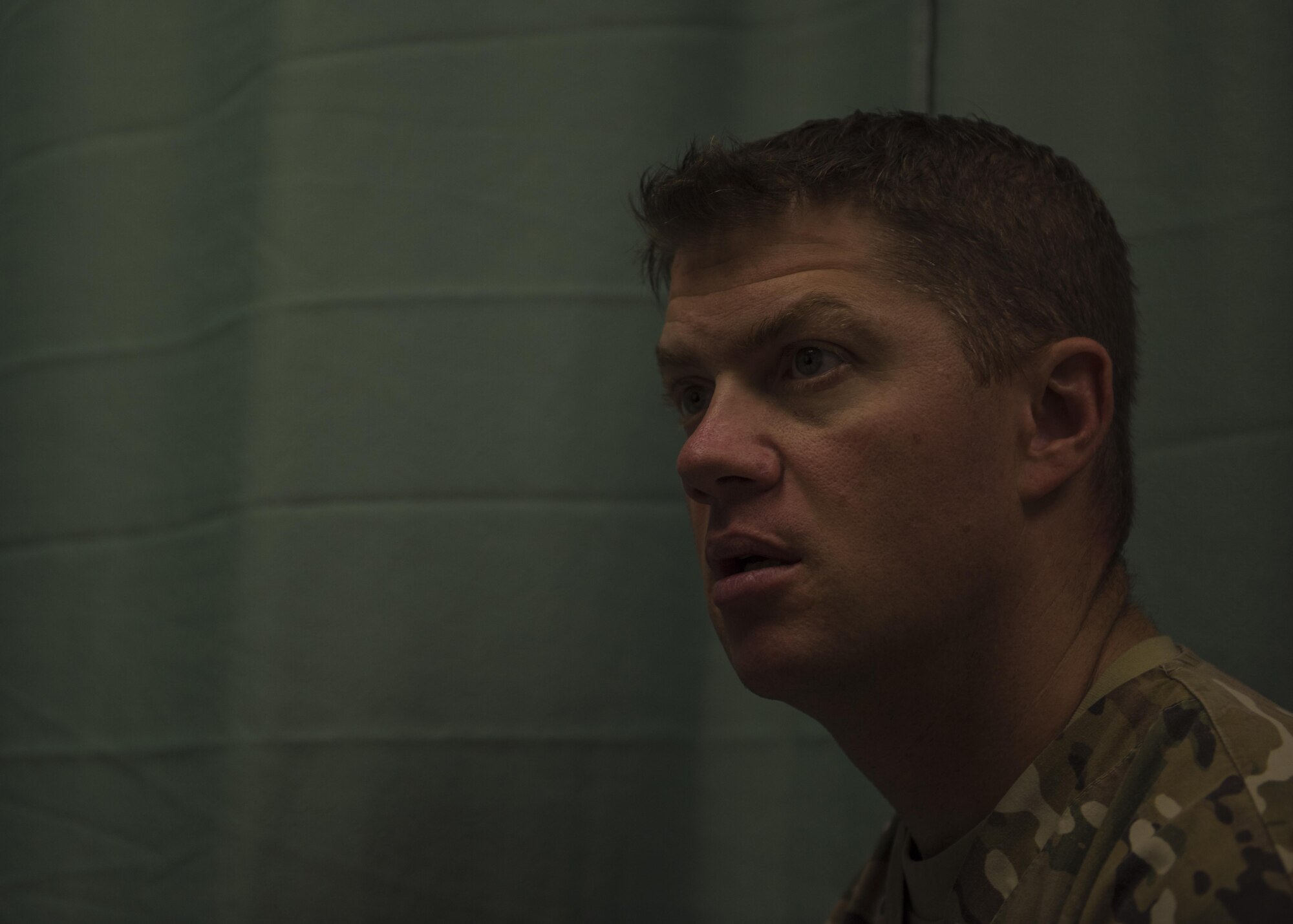 Maj. Brandon Morgan, 455th Expeditionary Medical Group physical therapist, listens to a patient during an evaluation, Bagram, Afghanistan, July 19, 2016. During an evaluation, patients describe their injury to better help the physical therapist design a treatment plan. (U.S. Air Force photo by Senior Airman Justyn M. Freeman)